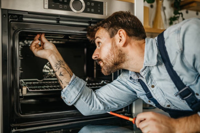 Technician repairing refrigerator